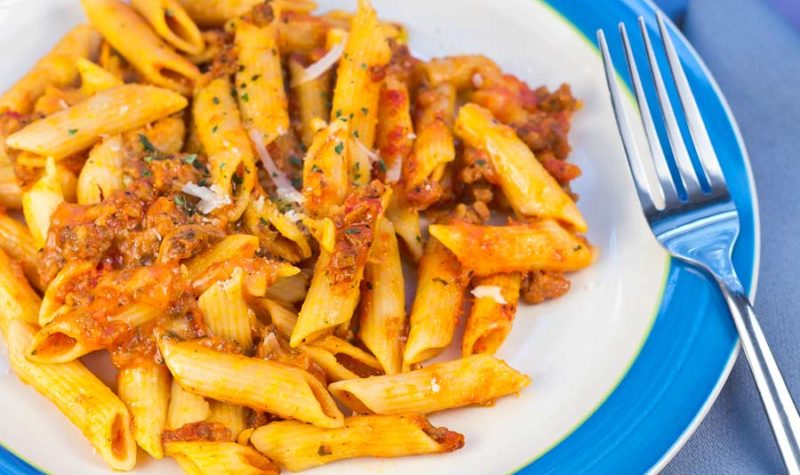 Mostaccioli with penne pasta, a red sauce and hamburger meat- topped with cheese