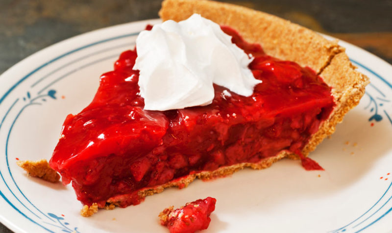 Strawberry Pie with graham cracker crust and whipped cream on top