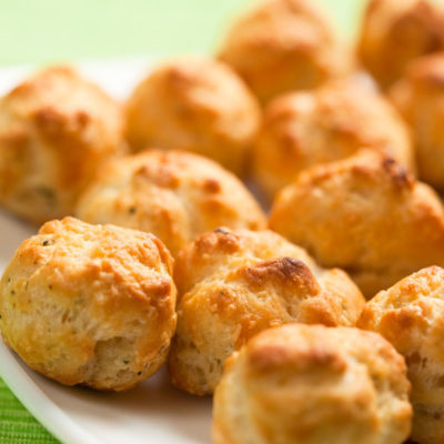 Baked cheese puffs on a white plate