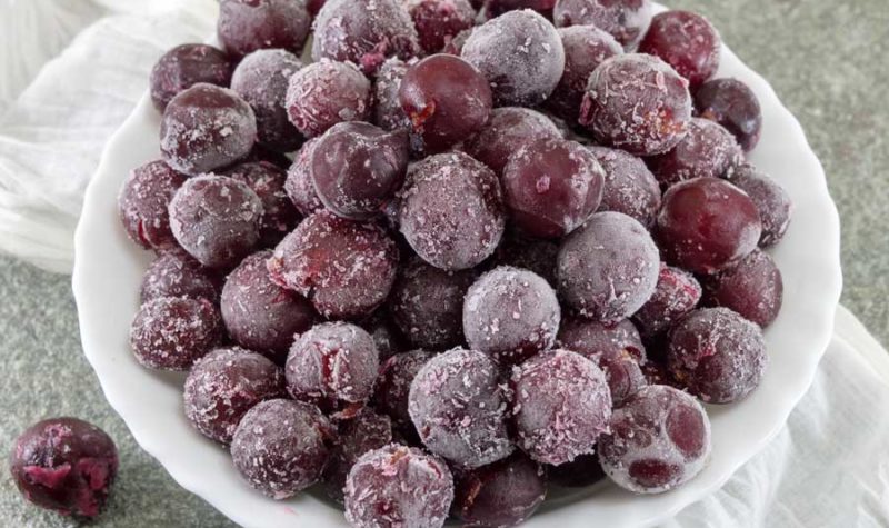 A bowl of frozen grapes.