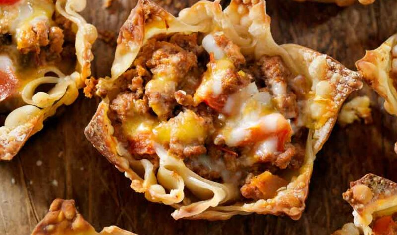 Crispy tacos made with wonton wrappers and filled with ground beef and cheese