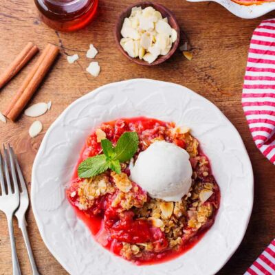 Rhubarb Butter Crunch on a white plate with ice cream