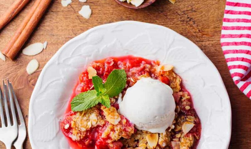 Rhubarb Butter Crunch on a white plate with ice cream