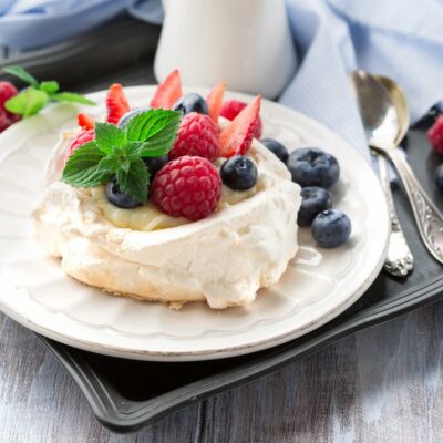 Pavlova topped with fresh berries.