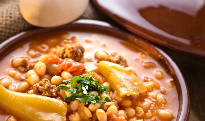 A bowl of pineapple baked beans with ground beef.