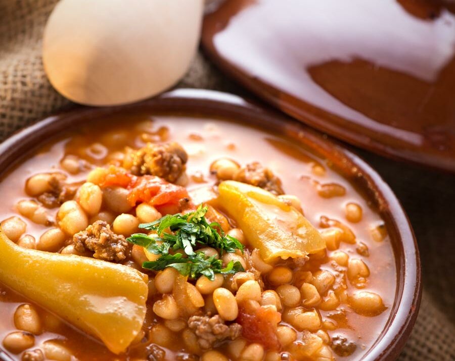 A bowl of pineapple baked beans with ground beef.