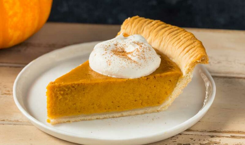 Pumpkin pie with some whipped cream on top