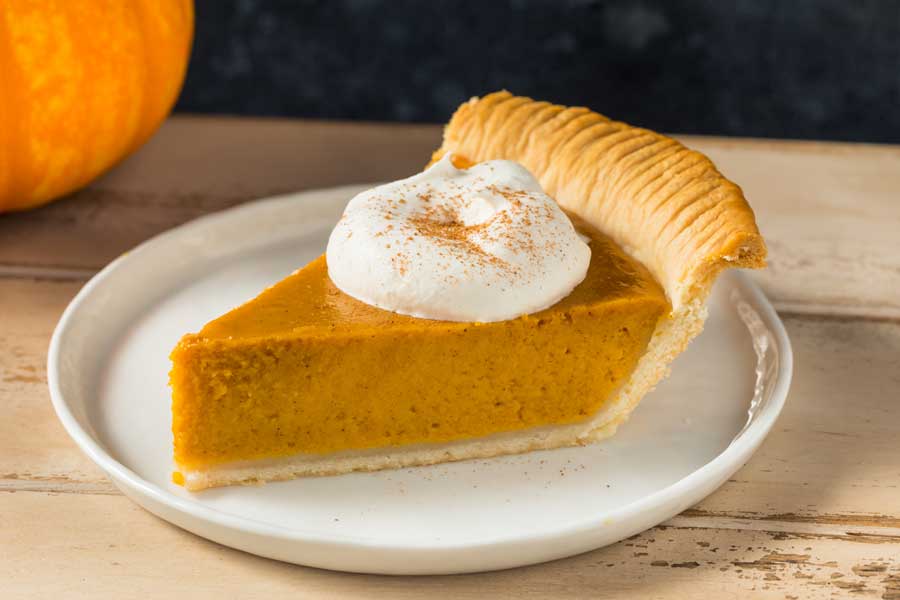 Pumpkin pie with some whipped cream on top