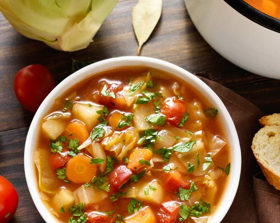 Cabbage soup in a white bowl