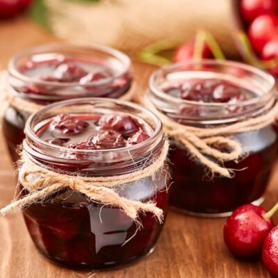 Cherry jam in glass jars