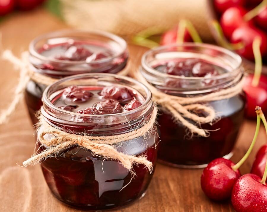 Cherry jam in glass jars