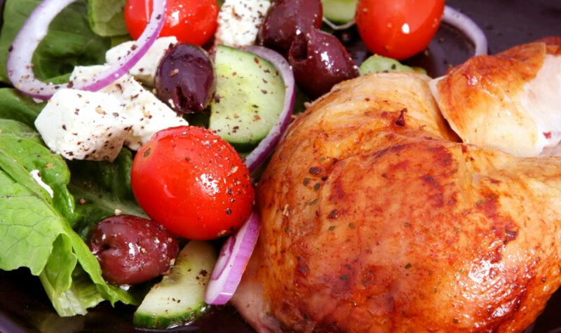 Greek chicken with tomatoes, cucumber, onions and feta