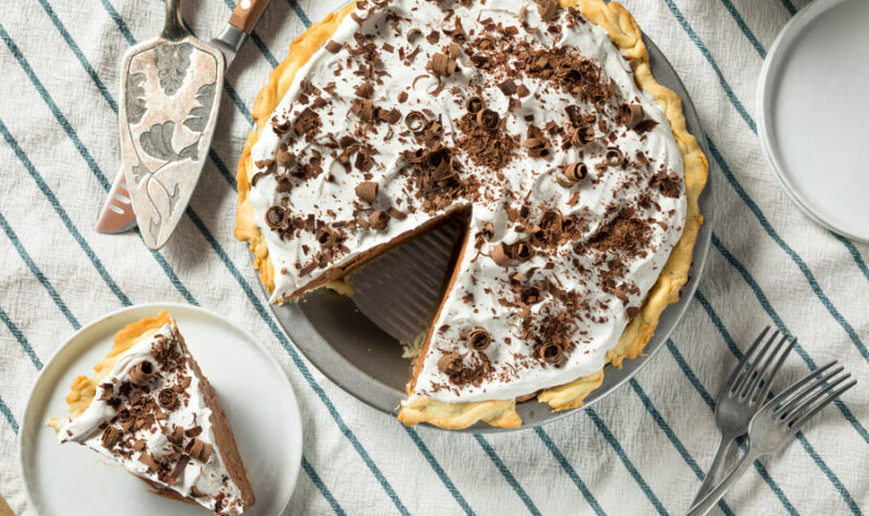 A double chocolate French Silk pie with a piece cut out.