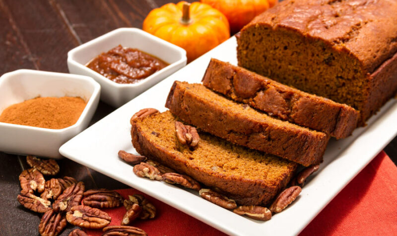 Pumpkin Bread on a white plate with nuts
