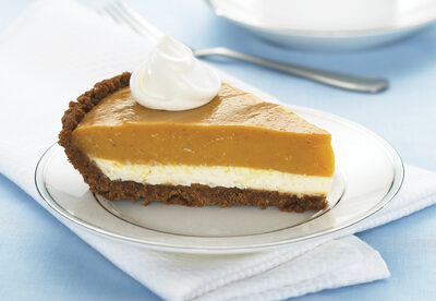 Double layer pumpkin pie on a white plate