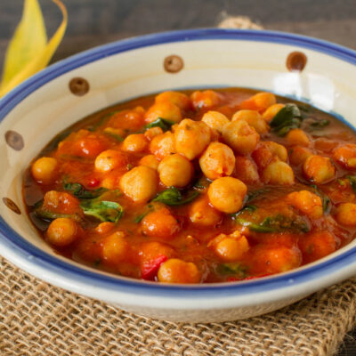 Chickpea curry in a white and blue bowl