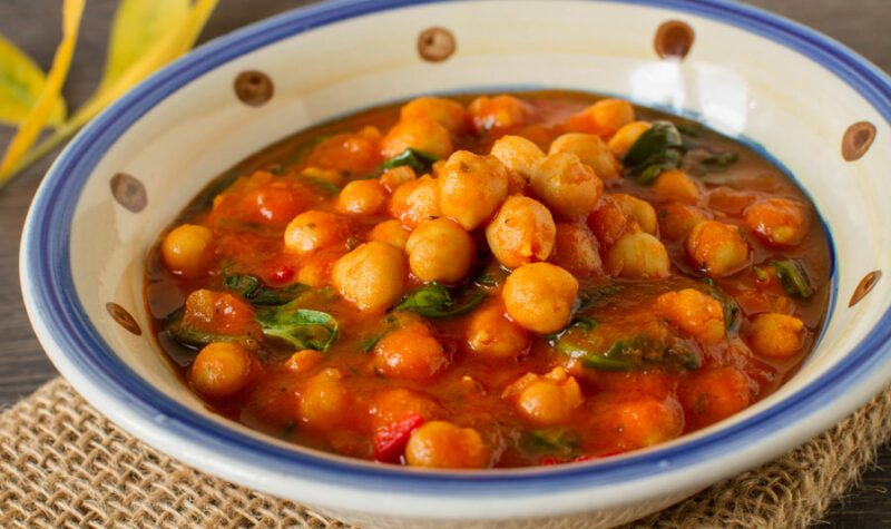 Chickpea curry in a white and blue bowl