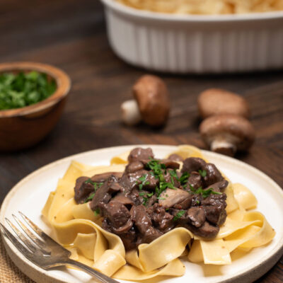 Sirloin Tips on egg noodles topped with parsley