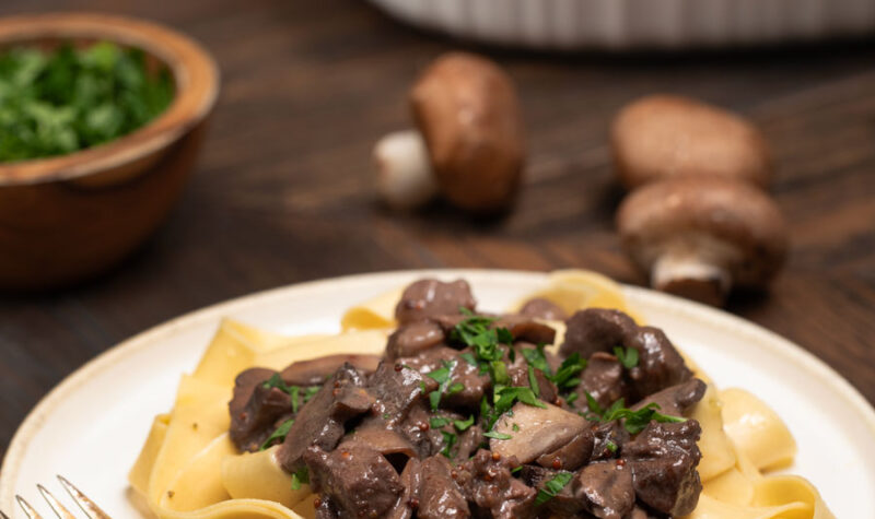 Sirloin Tips on egg noodles topped with parsley