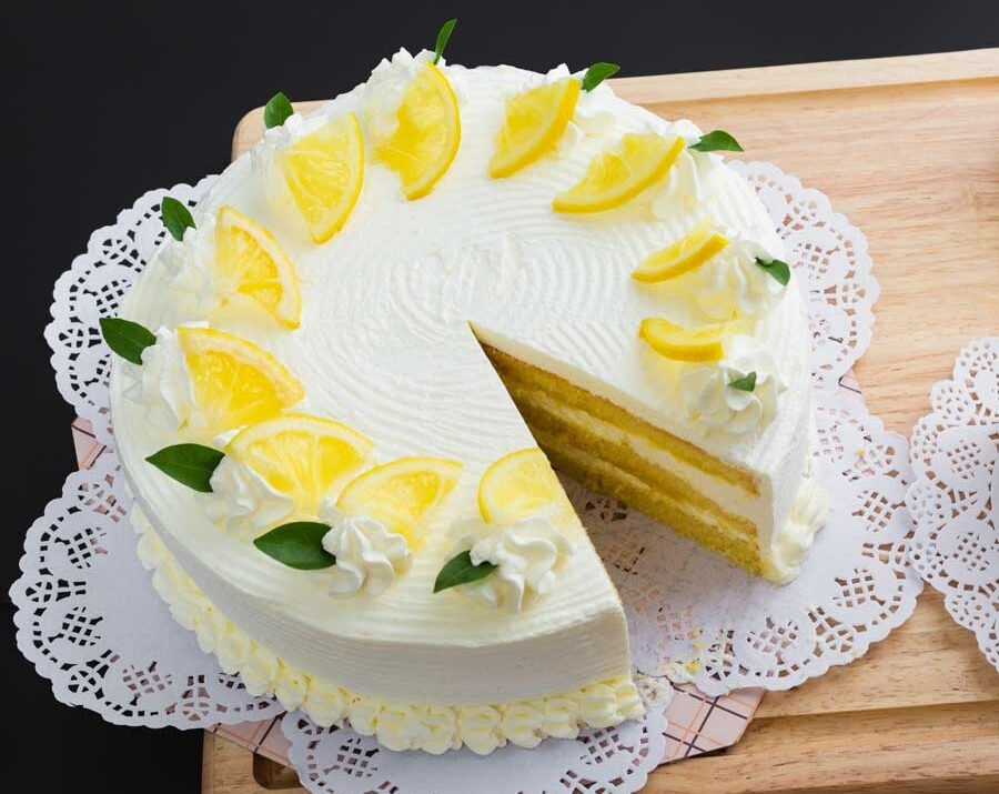 Lemon cake frosted with white whipped cream