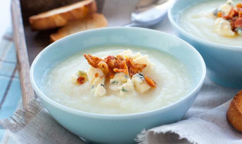 Cream of cauliflower soup topped with a bacon garnish