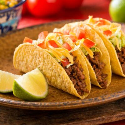 3 beef tacos on a plate.