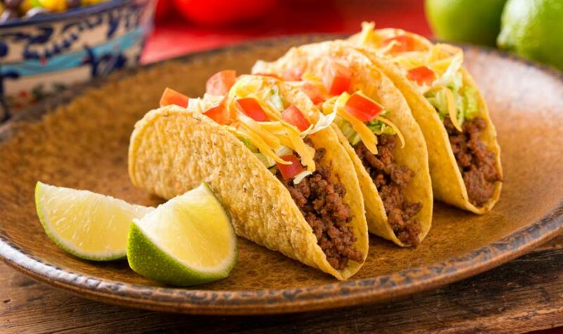 3 beef tacos on a plate.