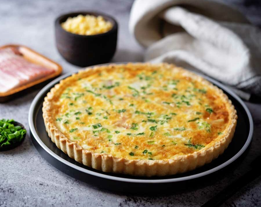 Bacon Quiche with cheese on a pan