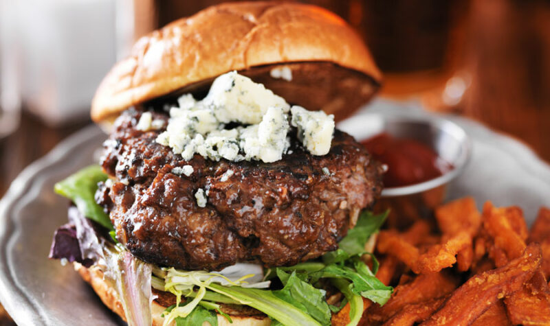 Blue Cheese Burgers on a plate with sweet potato fries