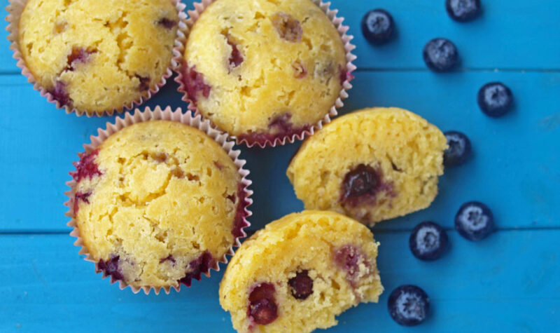 Blueberry Corn Muffins on a blue background