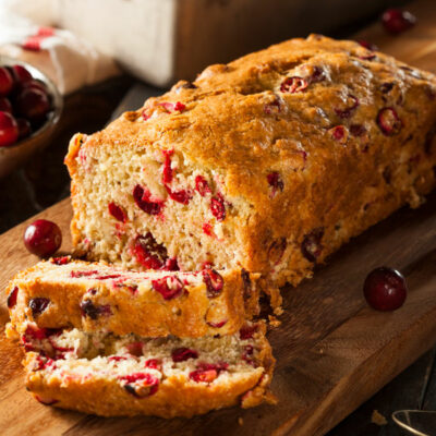 Orange Cranberry Nut bread on a cutting board