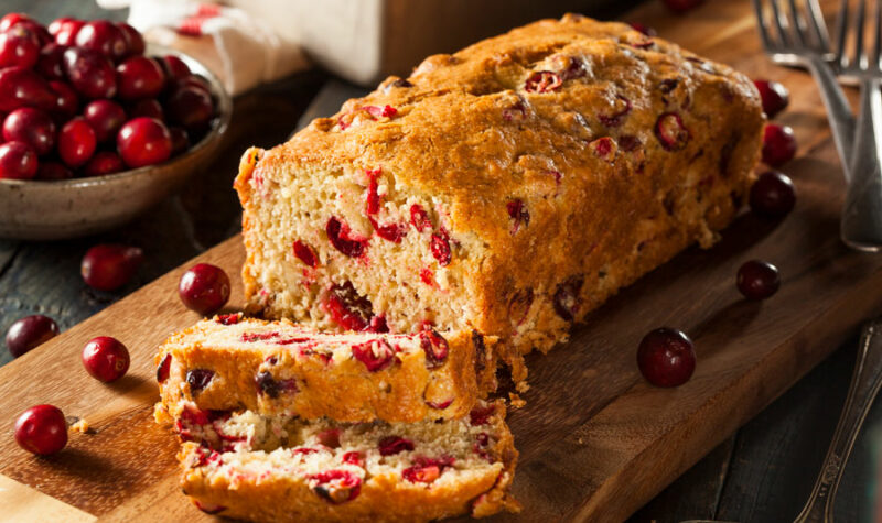 Orange Cranberry Nut bread on a cutting board