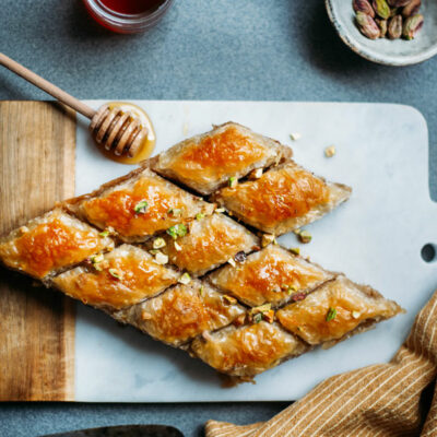 Baklava cut into diamond shapes on a cutting board