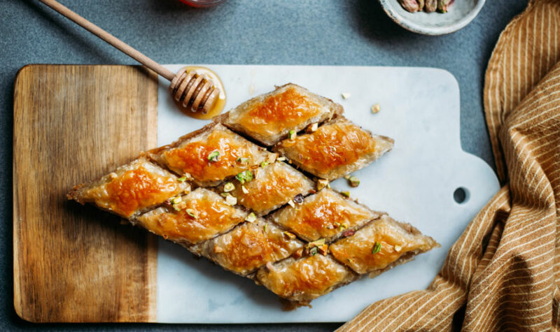 Baklava cut into diamond shapes on a cutting board