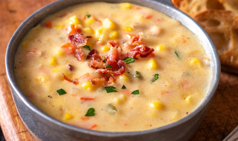 Corn Chowder with Bacon in a gray bowl