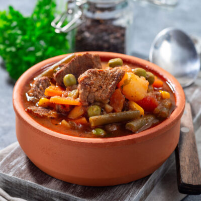 Slow Cooker Beef Stew in an orange pot