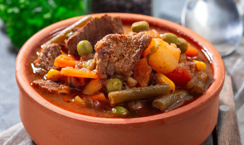Slow Cooker Beef Stew in an orange pot