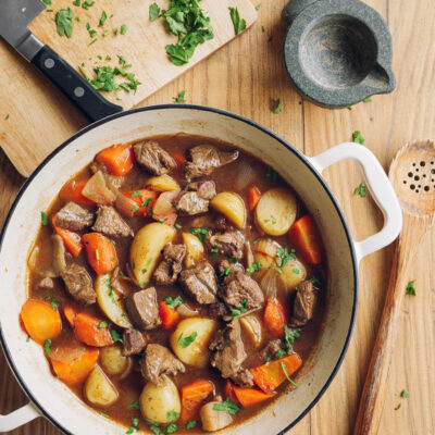 Slow Cooker Beef Stew with carrots and tomatoes in a large pot