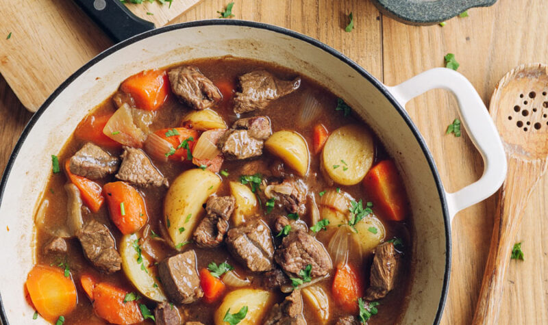 Slow Cooker Beef Stew with carrots and tomatoes in a large pot