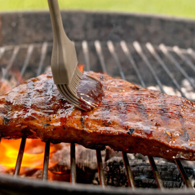 Barbecue sauce on roasted meat - stock photo