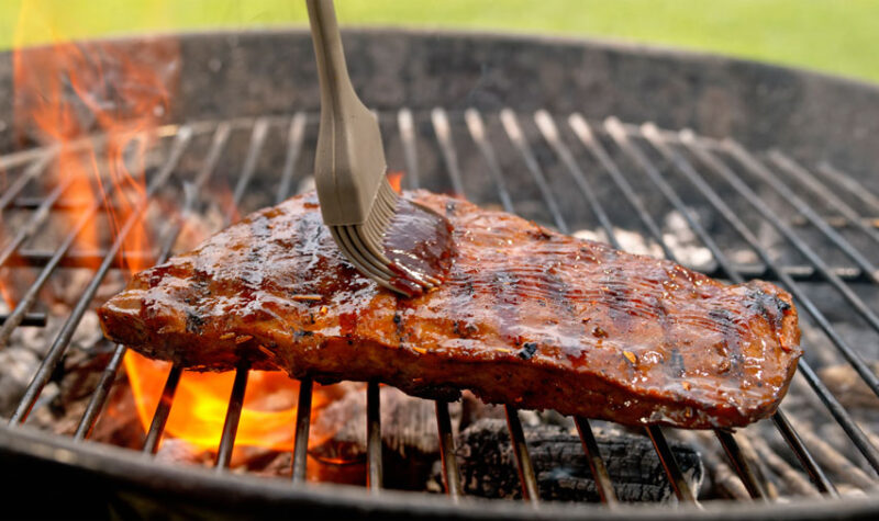 Barbecue sauce on roasted meat - stock photo
