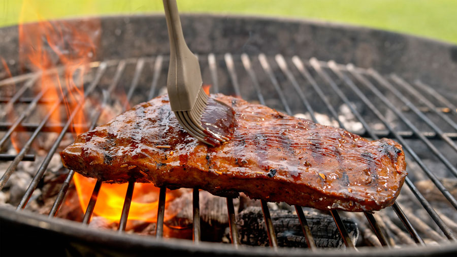Barbecue sauce on roasted meat - stock photo