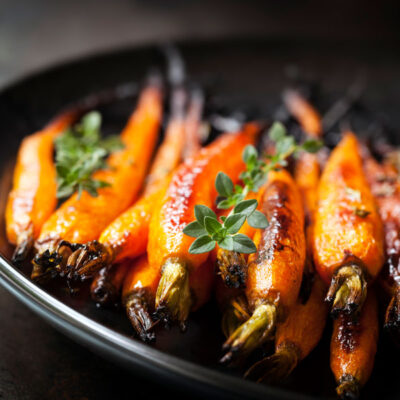 Baked Baby Carrots with Thyme - stock photo