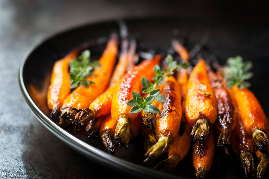 Baked Baby Carrots with Thyme - stock photo