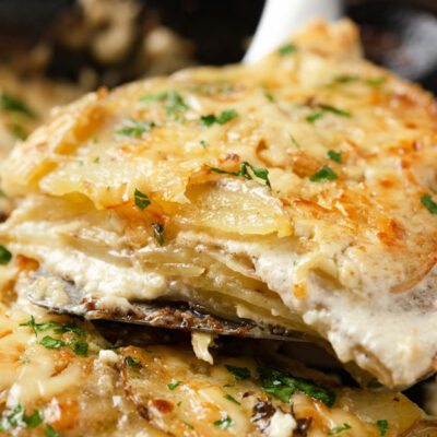 A closeup image of sheet pan scalloped potatoes