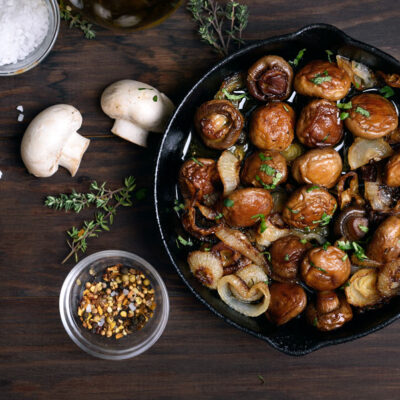 Marinated mushrooms in a skillet