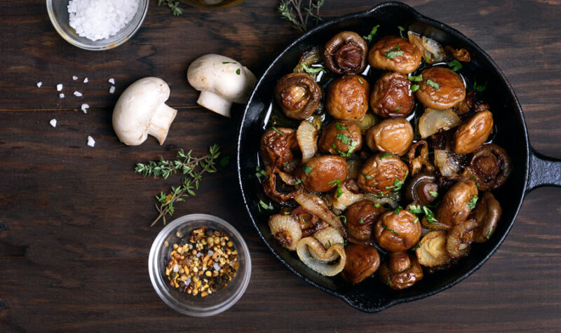 Marinated mushrooms in a skillet