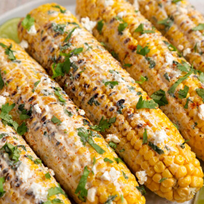Corn on the cob (elote) covered in mayo and spices
