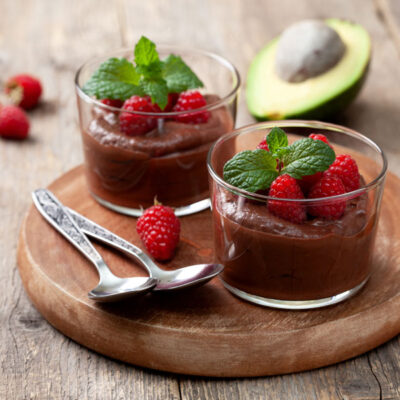 Avocado pudding with veggies and raspberries