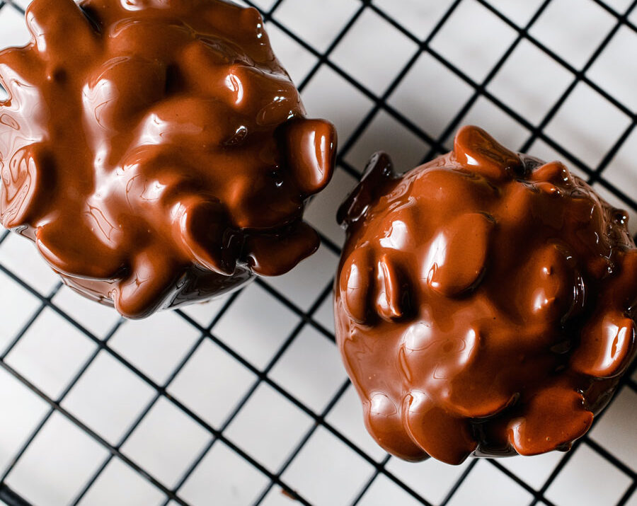 Chocolate peanut clusters on a baking mat